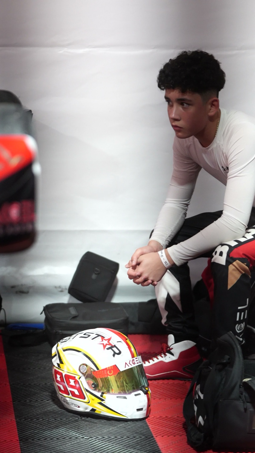 Brando Londoño in his race suit with his #99 helmet